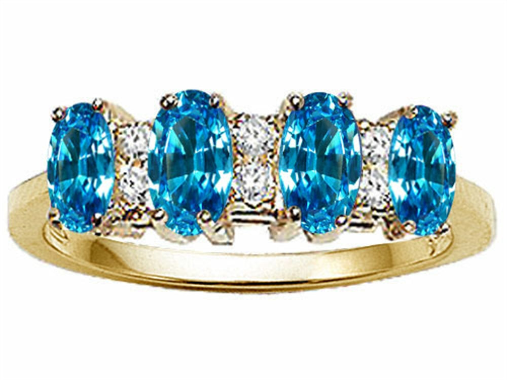 Tommaso Design Oval 5x3mm Genuine 4 Stone Blue Topaz Band