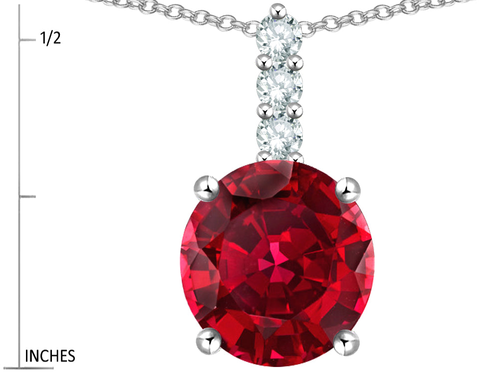 Star K  7mm Round Created Ruby Three Stone Pendant Necklace