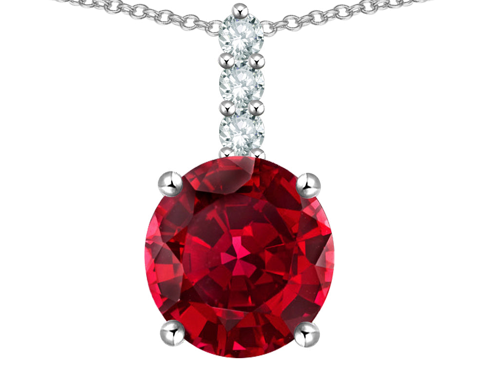 Star K  7mm Round Created Ruby Three Stone Pendant Necklace