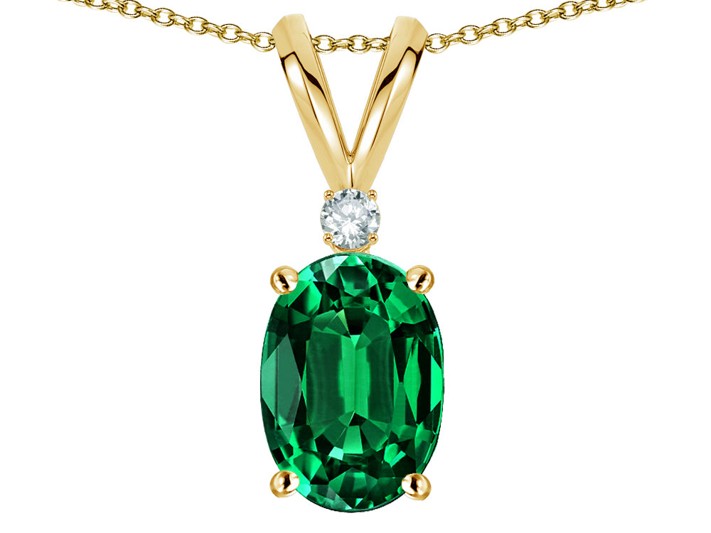 Star K Oval 7x5mm Simulated Emerald Classic Rabbit Ears Pendant Necklace
