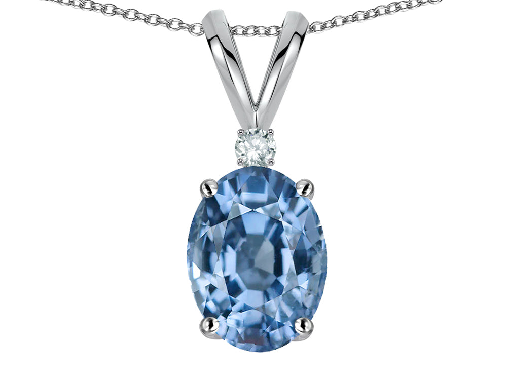 Star K Oval 7x5mm Simulated Aquamarine Classic Rabbit Ears Pendant Necklace
