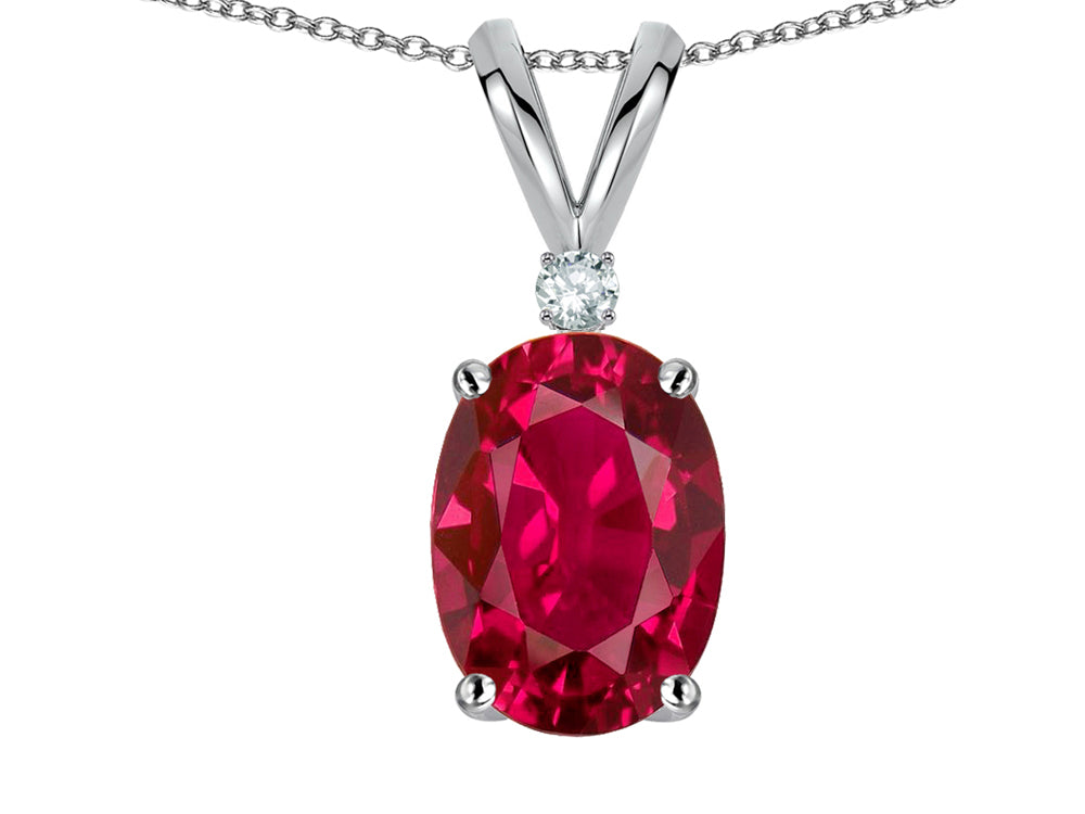 Star K Oval 7x5mm Created Ruby Classic Rabbit Ears Pendant Necklace