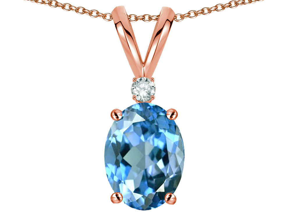 Star K Oval 7x5mm Genuine Blue Topaz Classic Rabbit Ears Pendant Necklace