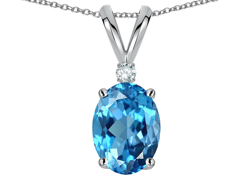 Star K Oval 7x5mm Genuine Blue Topaz Classic Rabbit Ears Pendant Necklace