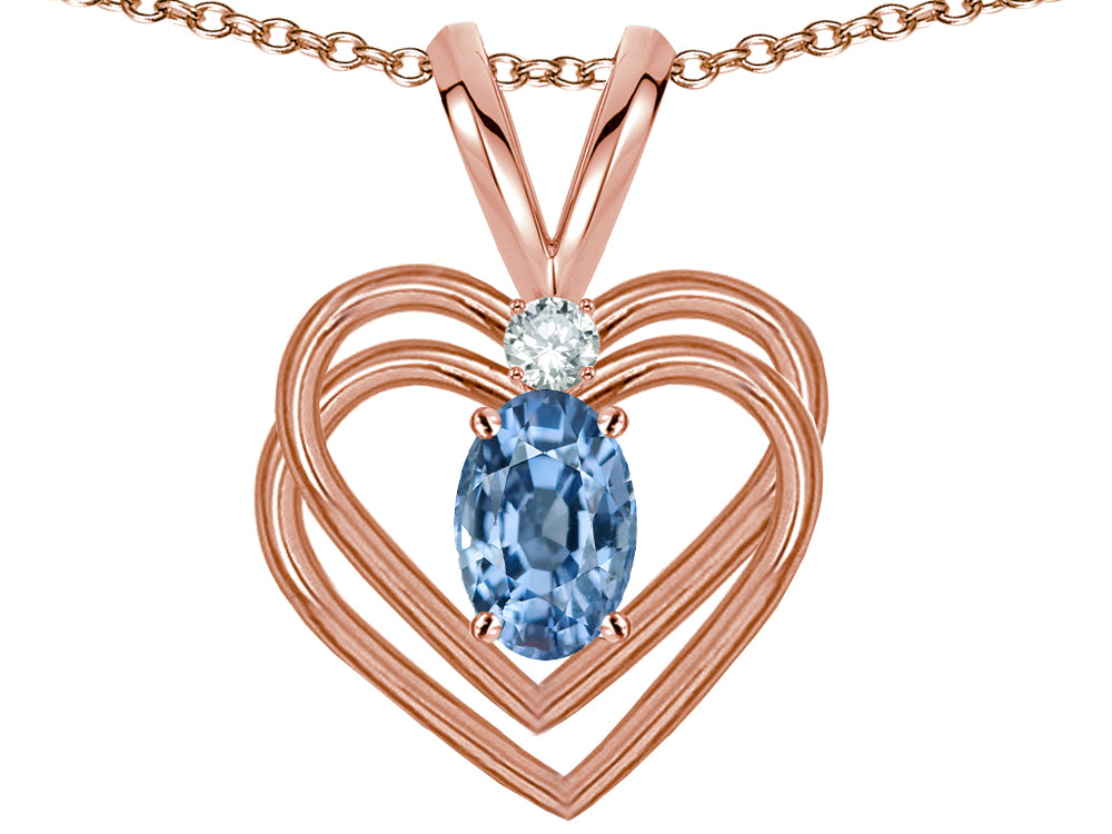 Star K Oval 5x3mm Simulated Aquamarine Knotted Double Heart Pendant Necklace