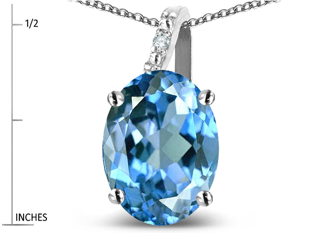 Star K 10k Gold Oval 9x7 Genuine Blue Topaz Journey Pendant Necklace