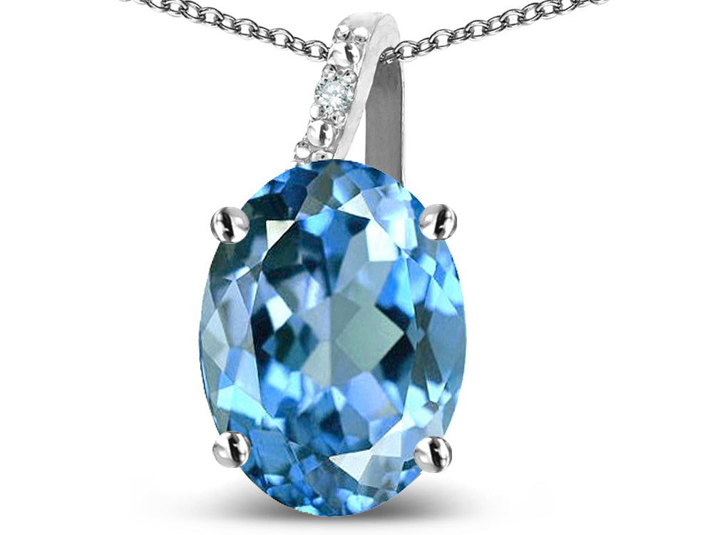 Star K 10k Gold Oval 9x7 Genuine Blue Topaz Journey Pendant Necklace