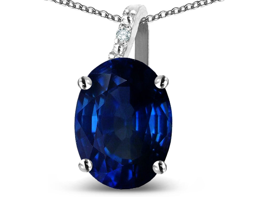 Star K 10k Gold Oval 9x7 Created Sapphire Journey Pendant Necklace