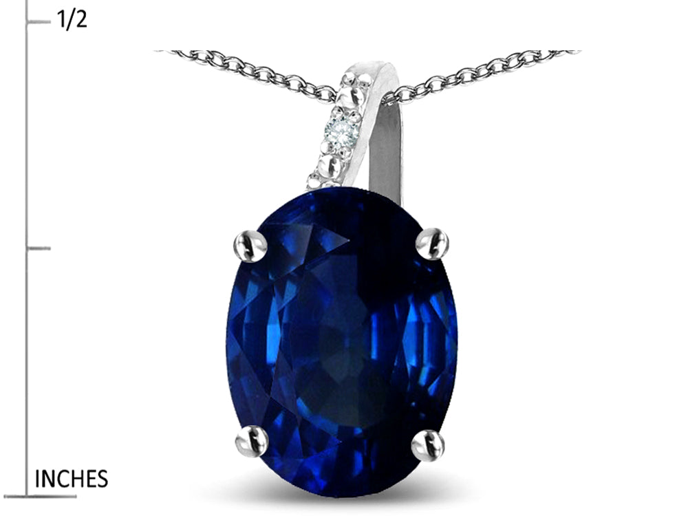 Star K Oval 8x6 Created Sapphire Journey Pendant Necklace