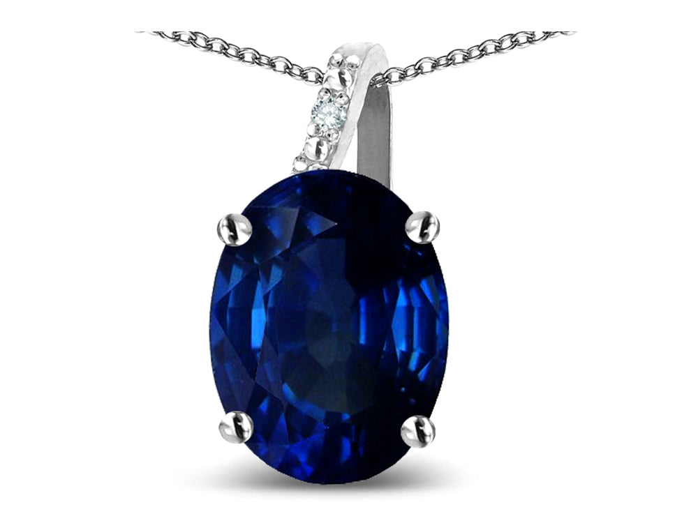 Star K Oval 8x6 Created Sapphire Journey Pendant Necklace