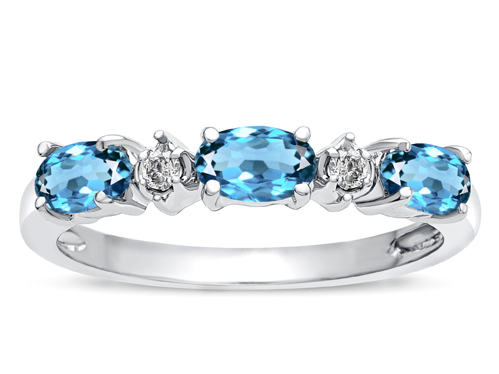 Star K  Oval 5x3 Genuine Blue Topaz three stone oval band
