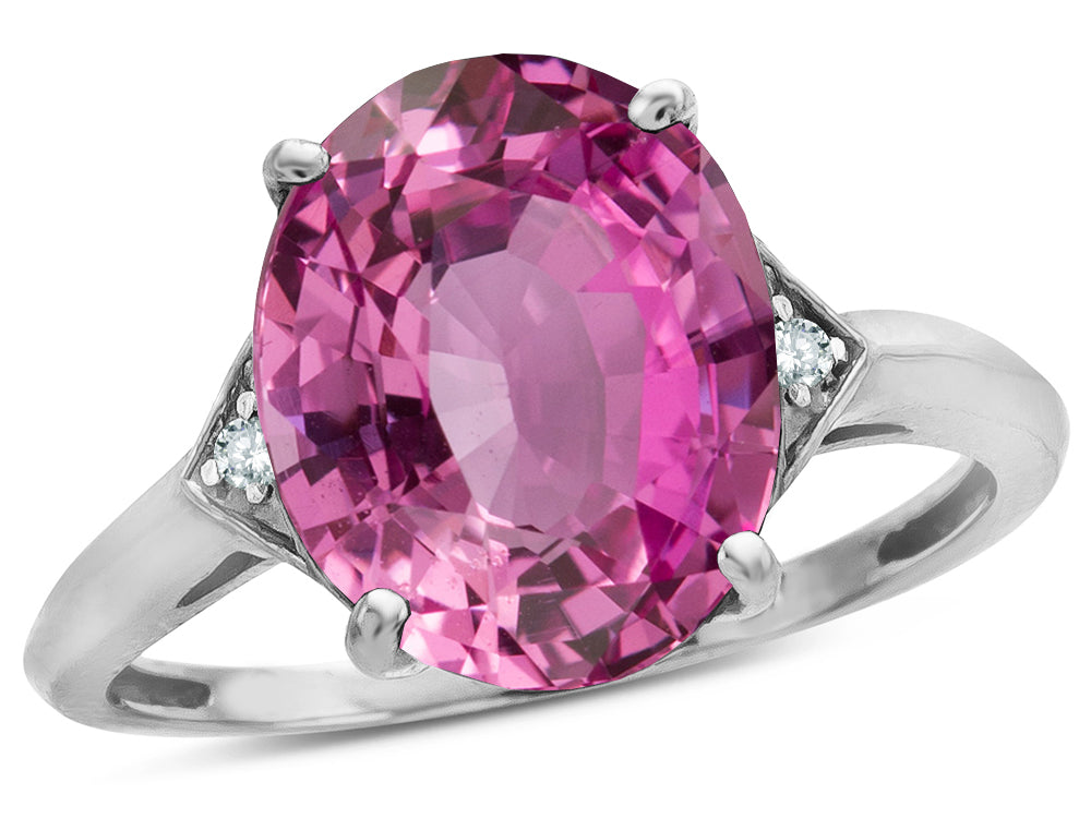 Star K  Large Oval 12x10 Created Pink Sapphire 3 Stone Trillion Setting Ring