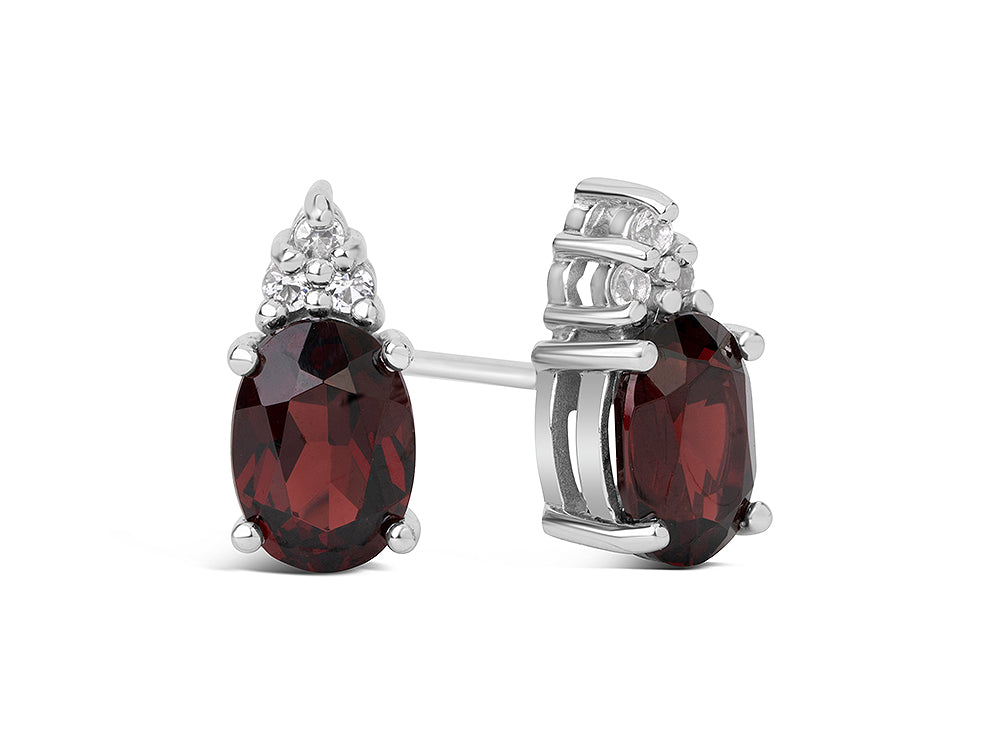FJC Finejewelers 10k White Gold 7x5mm Oval Garnet with Round White Topaz Earrings