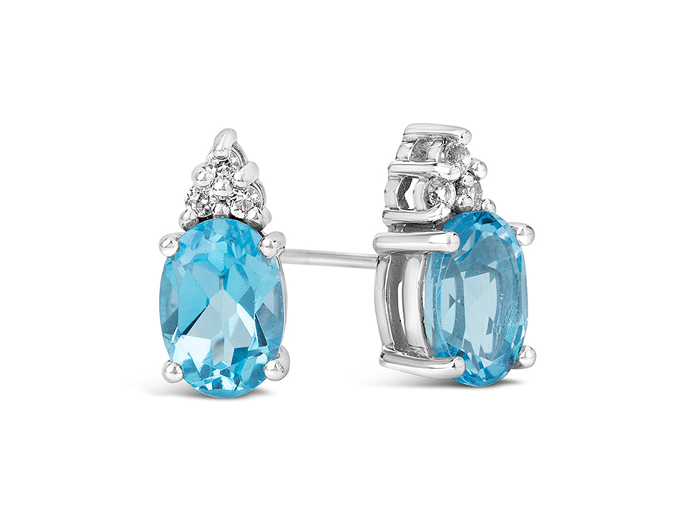FJC Finejewelers 10k White Gold 7x5mm Oval Swiss Blue Topaz with White Topaz Earrings