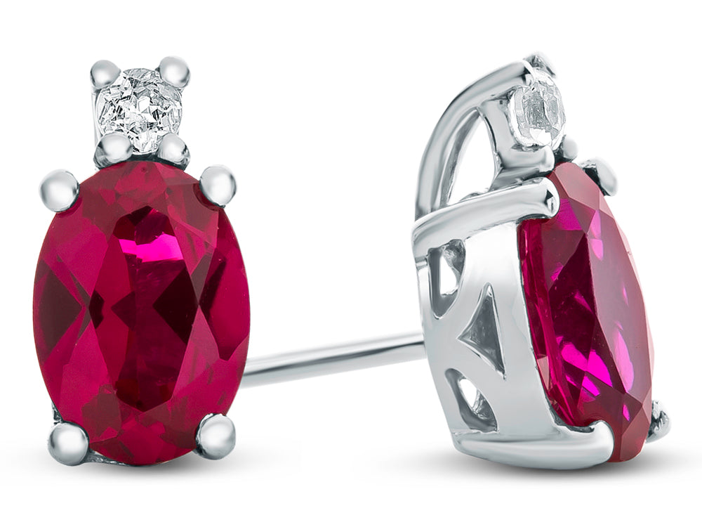 FJC Finejewelers 10k White Gold 7x5mm Oval Created Ruby with White Topaz Earrings