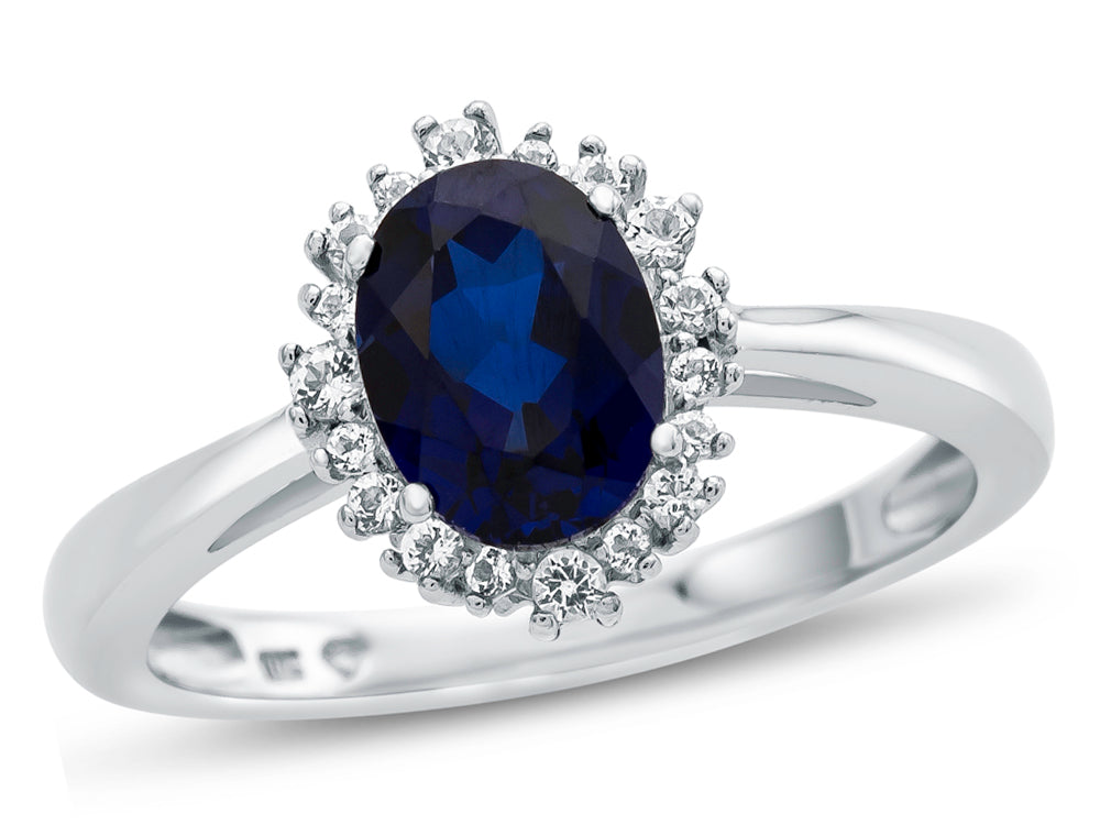 FJC Finejewelers 10k White Gold 8x6mm Oval Created Blue Sapphire with White Topaz accent stones Halo Ring