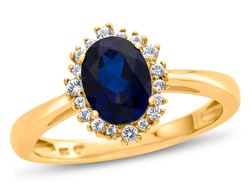 FJC Finejewelers 10k Yellow Gold 8x6mm Oval Created Blue Sapphire with White Topaz accent stones Halo Ring