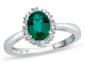 FJC Finejewelers 10k White Gold 8x6mm Oval Created Emerald with White Topaz accent stones Halo Ring