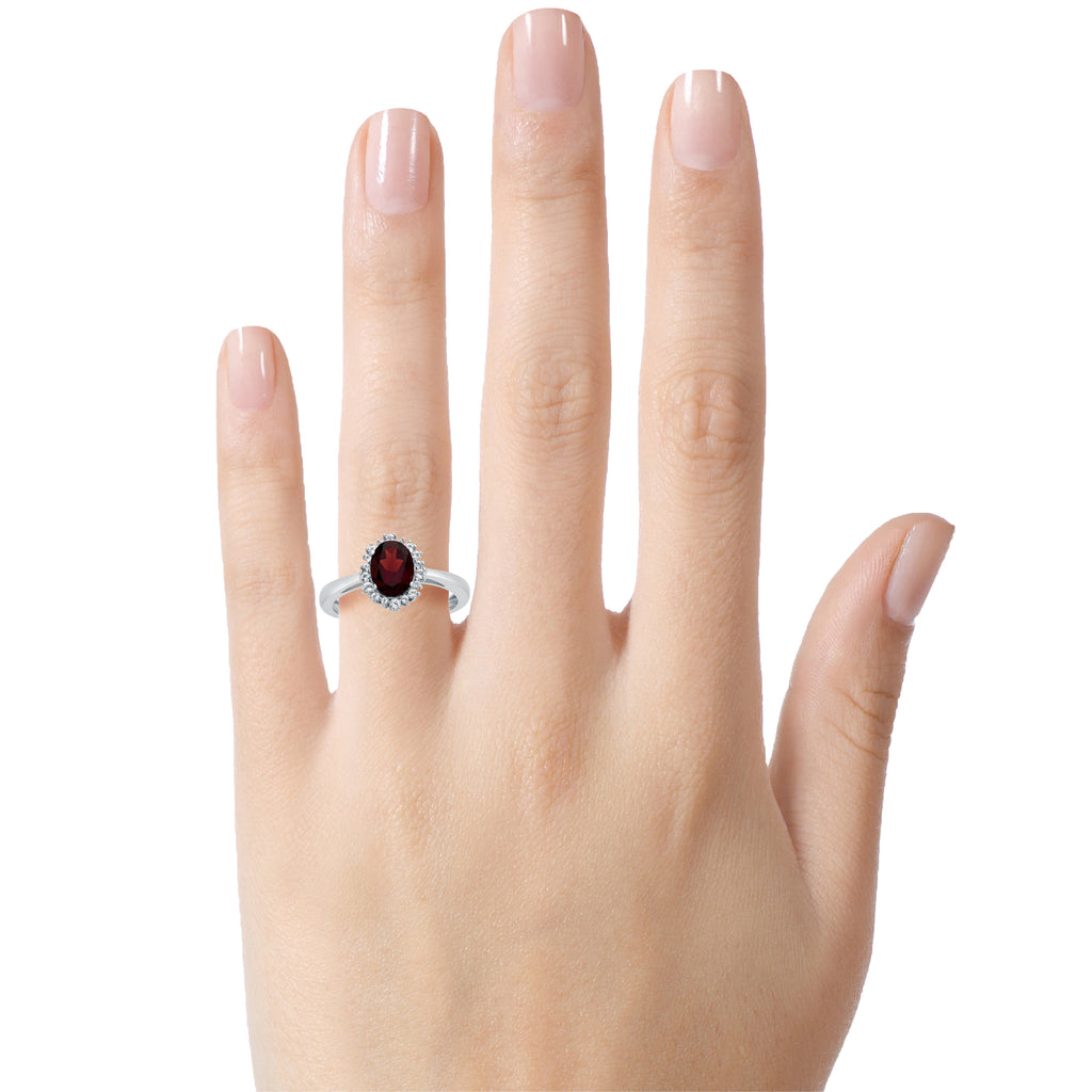 FJC Finejewelers 10k White Gold 8x6mm Oval Garnet with White Topaz accent stones Halo Ring