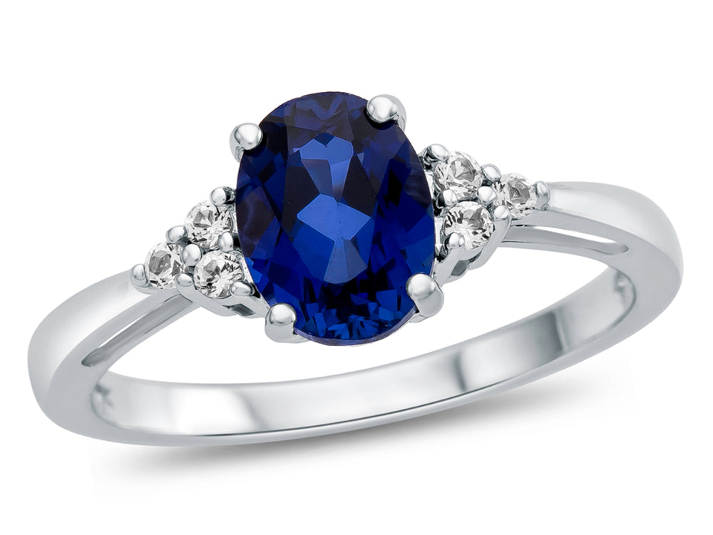 FJC Finejewelers 10k White Gold 8x6mm Oval Created Blue Sapphire and White Topaz Ring