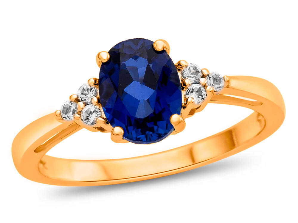 FJC Finejewelers 10k Yellow Gold 8x6mm Oval Created Blue Sapphire and White Topaz Ring