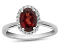 FJC Finejewelers 10k White Gold 7x5mm Oval Garnet with White Topaz accent stones Halo Ring