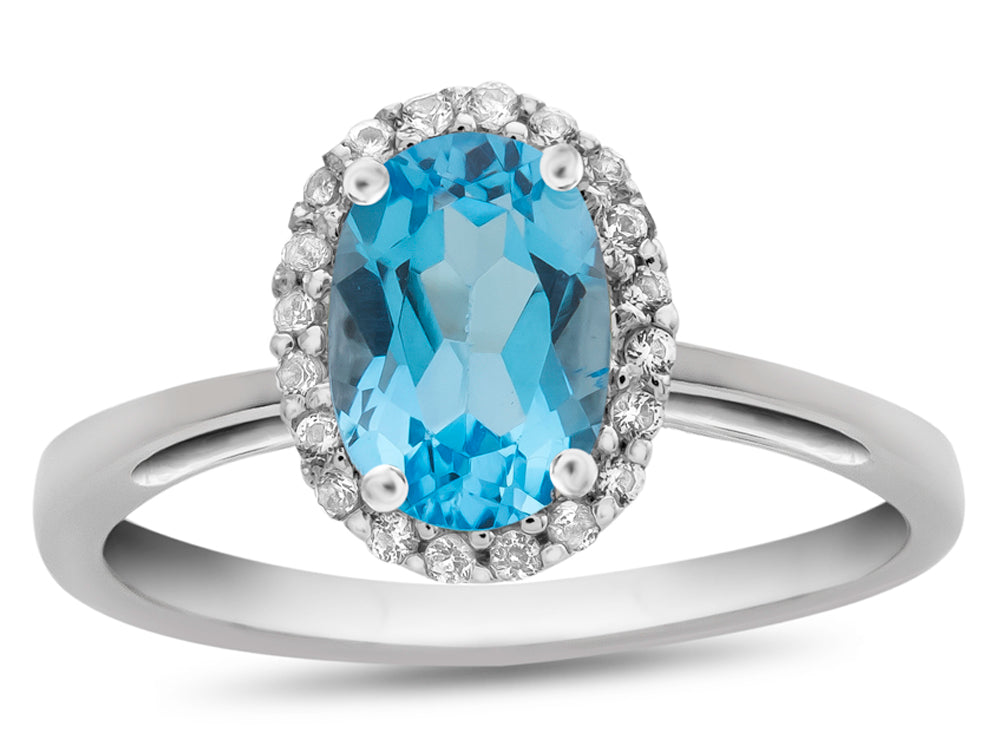 FJC Finejewelers 10k White Gold 7x5mm Oval Swiss Blue Topaz with White Topaz accent stones Halo Ring